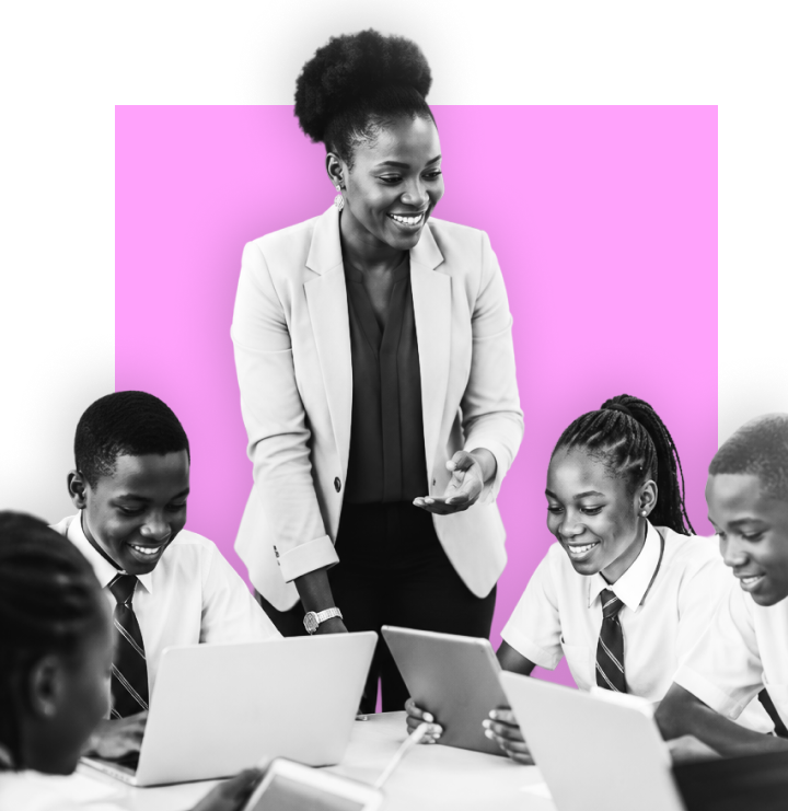 Teacher guiding students working on laptops